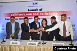 Chandra Bhan Prasad (second from right) at a function to launch Dalit Foods, which he hopes will help to end caste-based discrimination, New Delhi, July 2, 2016. (Courtesy photo from Dalit Foods)