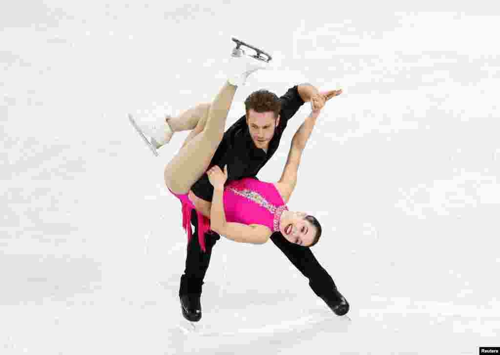 Canada's Lia Pereira and Trennt Michaud perform during the Pairs Short Program in the Four Continents Figure Skating Championships in Seoul, South Korea.
