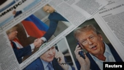FILE PHOTO: View of newspaper covers dedicated to Putin-Trump phone call at newsstand in Moscow