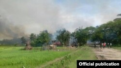 Smoke are seen here in the sky above a village in Yathay Taung Township. Aug. 27th, 2017.