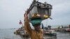 Men haul in a day’s catch, mostly the smaller sardinella fish, off the coast of Joal, Senegal, May 29, 2017. (R. Shryock/VOA)