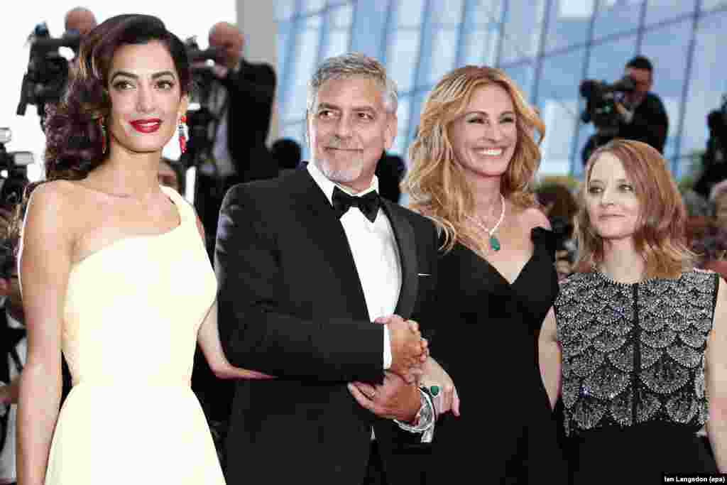 (L-R) British human rights lawyer Amal Clooney, U.S. actor George Clooney, actress Julia Roberts and director Jodie Foster arrive for the screening of 'Money Monster' during the 69th annual Cannes Film Festival, in Cannes, France.