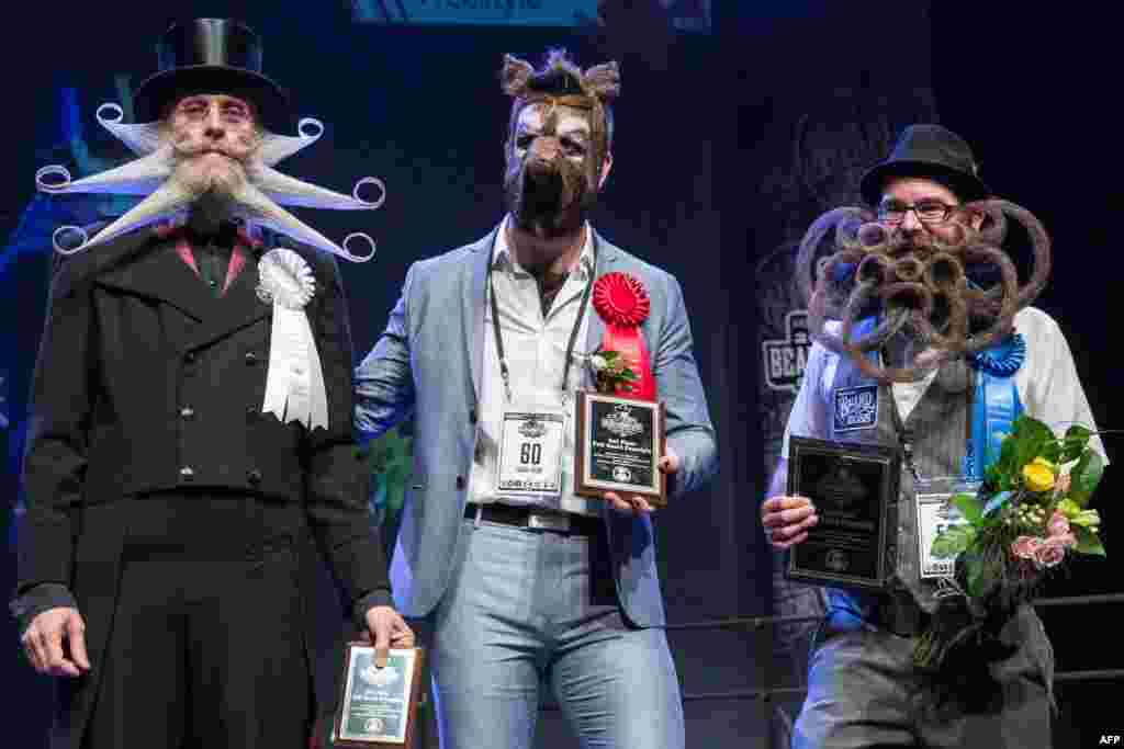 (L-R) Third, second and first place winners of the full beard freestyle: Aarne Bielefeldt, Isaiah Webb, and Jason Kiley at the 2017 Remington Beard Boss World Beard & Moustache Championships held at the Long Center for the Performing Arts in Austin, Texas, Sept. 3, 2017.