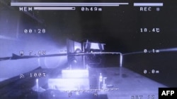 This handout taken on Feb. 28, 2024 and released by TEPCO shows a drone landing during the 'primary containment vessel internal investigation' of Unit 1 at the crippled Fukushima Daiichi Nuclear Power Plant in Okuma, Fukushima prefecture. (TEPCO/AFP)