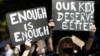 FILE - Thousands of people with placards and banners rally demanding justice for women in Sydney, Monday, March 15, 2021, as the government reeled from two separate allegations. The rally was one of several across Australia.