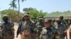 Kagame (no centro) e Nyusi (direita), em Cabo Delgado