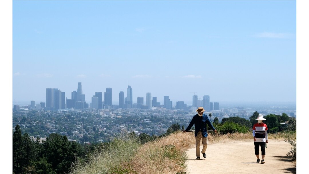 Walkers use recently re-opened hiking paths inside Griffith Park, May 14, 2020, in Los Angeles.