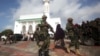 Soldiers serving in the African Union Mission in Somalia patrol outside a Mosque during Eid al-Fitr prayers, marking the end of the fasting month of Ramadan, in Mogadishu, July 17, 2015.
