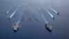 美国海军的尼米兹号和里根号航空母舰组成的双航母战斗群7月6日在南中国海航行。（美国海军提供）