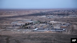 FILE - This Dec. 29, 2019, aerial file photo taken from a helicopter shows Ain al-Asad air base in the western Anbar desert, Iraq. 
