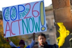 Activists participate in a climate change protest in Glasgow, Scotland on Oct. 30, 2021, ahead of the start of COP26.