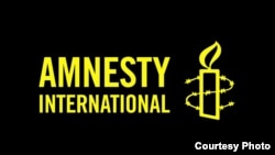 Logo međunarodne organizacije za ljudska prava Amnesti internešnel. 