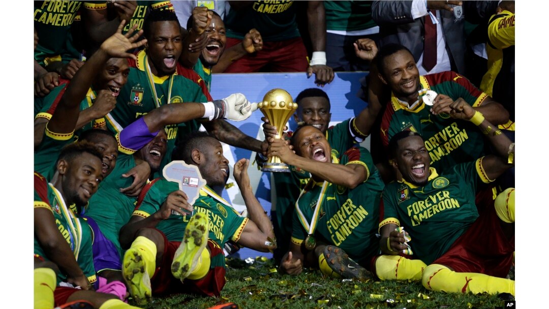 Cameroon players celebrate with the trophy after winning the African Cup of Nations final soccer match between Egypt and Cameroon at the Stade de l'Amitie, in Libreville, Gabon, Sunday, Feb. 5, 2017. Cameroon won 2-1.