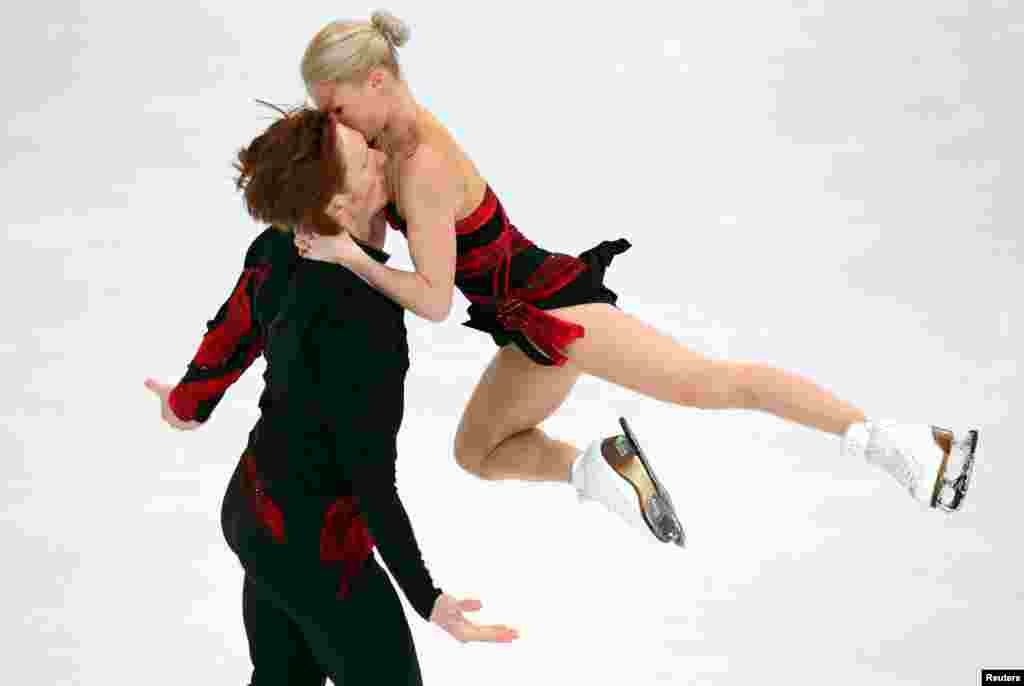 Evgenia Tarasova and Vladimir Morozov of Russia compete during the Olympic Qalifying ISU Challenger Series figure skating competition in Oberstdorf, southern Germany.