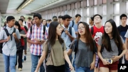 FILE - Students arrive for the first day of school at Stuyvesant High School in New York. 