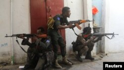 FILE - Somali security forces hold their positions near the mayor's office following a blast in Mogadishu, Somalia, Jan. 22, 2023. Authorities reported that at least 20 al-Shabab militants were killed in a military strike in central Somalia on Jan. 25, 2024.