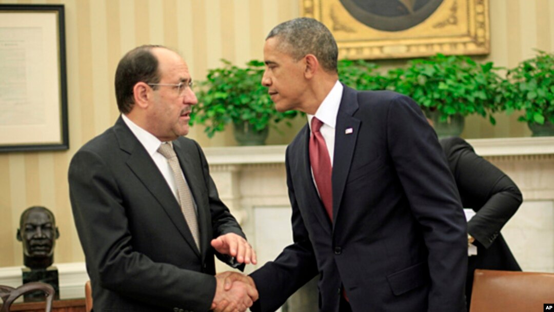 President Barack Obama shakes hands with Iraqi Prime Minister Nouri al-Maliki, Nov. 1, 2013, following their meeting in the Oval Office of the White House.