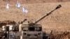 An Israeli army M109 155mm self-propelled howitzer is deployed at a position along the border with the Gaza Strip near Sderot in southern Israel on October 27, 2023 amid ongoing battles between Israel and the Palestinian Hamas movement.