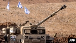 An Israeli army M109 155mm self-propelled howitzer is deployed at a position along the border with the Gaza Strip near Sderot in southern Israel on October 27, 2023 amid ongoing battles between Israel and the Palestinian Hamas movement.