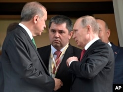 Turkish President Recep Tayyip Erdogan, left, speaks to Russian President Vladimir Putin, right, as he leaves after their meeting in Putin's residence in the Russian Black Sea resort of Sochi, Russia, Wednesday, May 3, 2017.