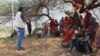 Indigenous Kenyan men attend a training session on ending female genital mutilation in Olmoti village, Kajiado County, Kenya in April 2024.
