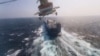 FILE - Houthi military helicopter flies over the Galaxy Leader cargo ship in the Red Sea in this photo released Nov. 20, 2023. (Houthi Military Media/Handout via REUTERS) 
