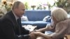 Russia's President Vladimir Putin congratulates the head of the Moscow Helsinki Group, Lyudmila Alekseyeva, on her 90th birthday during a meeting in Moscow, July 20, 2017. 