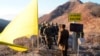 FILE - In this photo provided by South Korea Defense Ministry, South Korean army soldiers, wearing helmets, prepare to cross the Military Demarcation Line as North Korean army soldiers stand inside the Demilitarized Zone in Cheorwon, on Dec. 12, 2018. 