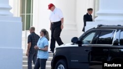 Predsednik Tramp izlazi iz Bele kuće i kreće za svoj golf klub u Sterlingu u Virdžiniji, 14. jula 2019.