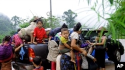 FILE - More than 4,000 ethnic Karen have abandoned a camp and villages in eastern Burma to seek refuge in Thailand following government attacks on ethnic insurgents.