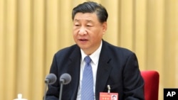 Chinese President Xi Jinping speaks at the annual Central Economic Work Conference in Beijing, Dec. 12, 2023. (Xinhua via AP)
