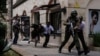 Kenyan security forces help people escape after a blast at Dusit D2 hotel in Nairobi, Kenya, Jan. 15, 2019. A blast followed by a gun battle rocked the hotel and office complex in Nairobi, causing casualties, in an attack claimed by the Al-Qaida-linked Al-Shabab Islamist group.