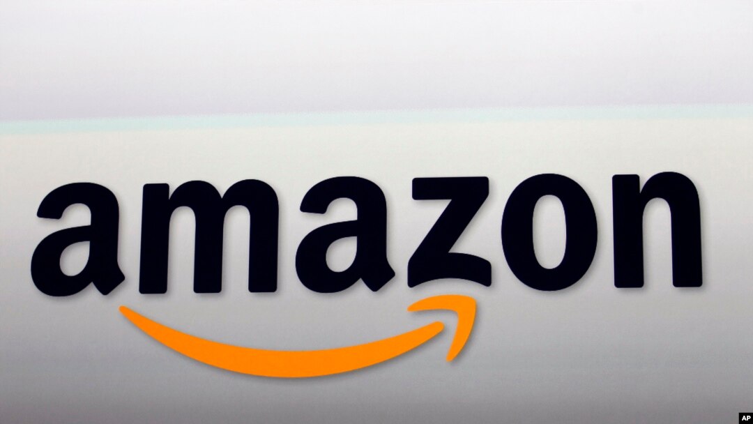 FILE - Amazon's logo. Amazon is attempting to develop glasses that pair with Alexa and would allow users to access the voice-activated assistant outside the home, according to a newspaper report, Sept. 20, 2017
