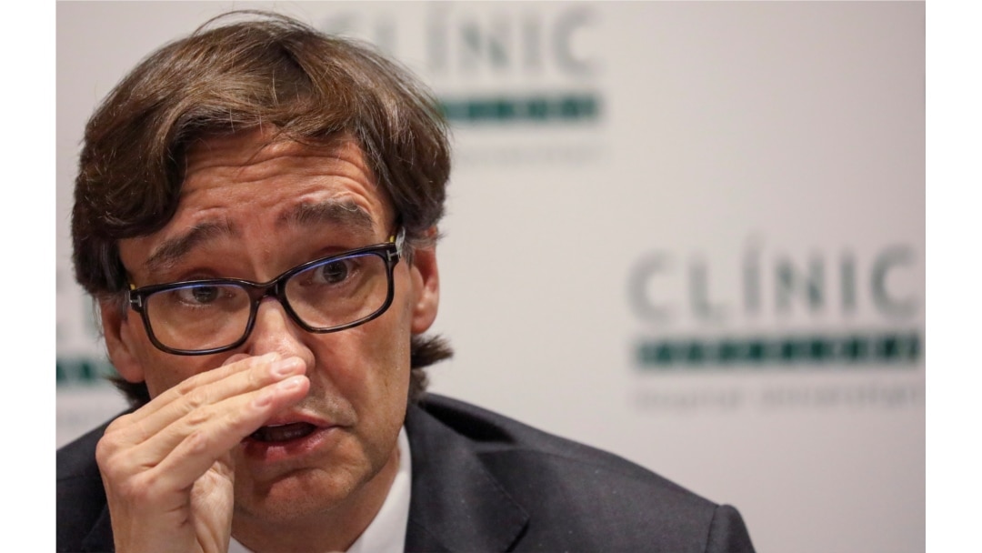 FILE - Spain's Health Minister Salvador Illa speaks at Hospital Clinic in Barcelona, Spain, Feb. 12, 2020.