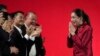 FILE - Pheu Thai Party leader Paetongtarn Shinawatra, right, daughter of Thailand's former Prime Minister Thaksin Shinawatra, offers a traditional greeting known as a "wai" to members of Pheu Thai Party in Bangkok, Thailand, Oct. 27, 2023. 