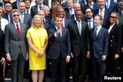 French President Macron poses for a family picture with Rwanda's President Kagame, Facebook's CEO Mark Zuckerberg and IMB's CEO Virginia Rometty at the Elysee Palace in Paris, May 23, 2018.