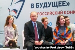 RUSSIA -- Russian President Vladimir Putin meets with students, authors of the best essays on a topic 'Russia Focused on the Future' in Moscow, January 11, 2018