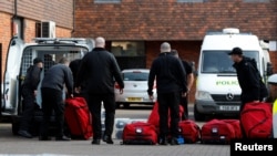 Inspectors from the Organisation for the Prohibition of Chemical Weapons (OPCW) arrive to begin work at the scene of the nerve agent attack on former Russian agent Sergei Skripal, in Salisbury, Britain March 21, 2018. REUTERS/Peter Nicholls