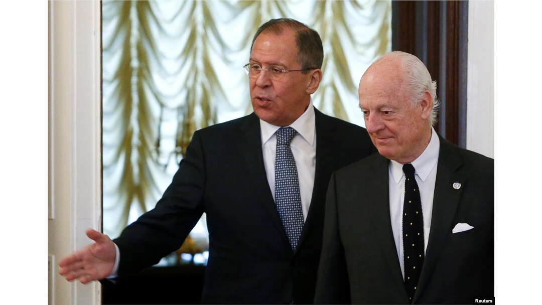 Russian Foreign Minister Sergei Lavrov (L) shows the way to United Nations special envoy on Syria Staffan de Mistura during a meeting in Moscow, Russia, May 3, 2016.