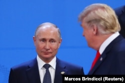 ARGENTINA -- U.S. President Donald Trump and Russian President Vladimir Putin are seen during the G20 leaders summit in Buenos Aires, November 30, 2018.