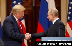 FINLAND -- U.S. President Donald Trump (L) and Russian President Vladimir Putin shake hands during a joint press conference following their summit talks at the Presidential Palace in Helsinki, July, 16, 2018
