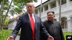 Predsednik Tramp i severnokorejski lider Kim Džong Un na samitu u Singapuru.