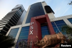FILE - The logo of Pakistan Stock Exchange is seen at its headquarters in Islamabad, Pakistan, Nov. 23, 2017.