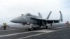 ເຮືອບິນລົບ A F-18E ຈອດຢູ່ເທິງເດີ່ນຂອງກຳປັ່ນບັນທຸກເຮືອບິນ USS Theodore Roosevelt ໃນວັນພະຫັດ ທີ 11 ເມສາ 2024 ໃນລະຫວ່າງ ການຊ້ອມລົບຮ່ວມຂອງກອງທັບເຮືອ ໄລຍະສາມວັນ ໂດຍ ສະຫະລັດ, ຍີ່ປຸ່ນ ແລະ ເກົາຫຼີໃຕ້ ຢູ່ໃນທະເລຈີນຕາເວັນອອກ.