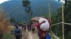 People displaced by fighting in north-western Myanmar between junta forces and anti-junta fighters walk in Chin State, Myanmar, May 31, 2021. Picture taken May 31, 2021. REUTERS/Stringer