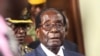 Zimbabwean President Robert Mugabe is seen upon arrival for his annual State of the Nation address at Parliament in Harare, Tuesday, Dec. 6, 2016. 