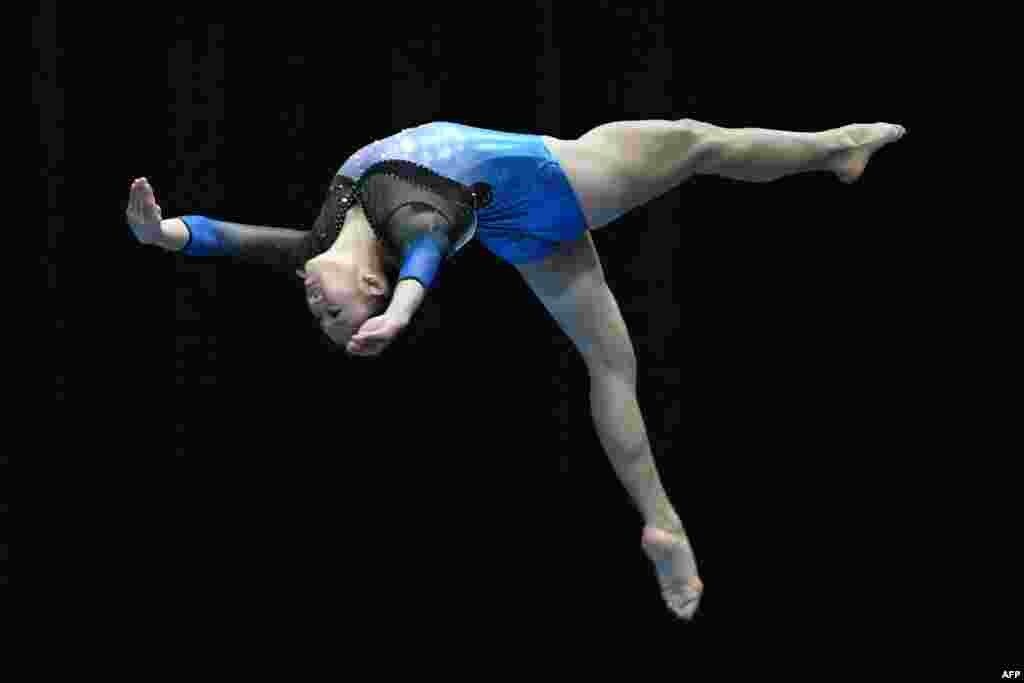 Malaysia's Tang Ing Yueh competes in the women's artistic gymnastic balance beam final event of the 29th Southeast Asian Games (SEA Games) in Kuala Lumpur, Malaysia.