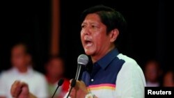 FILE - Philippines Vice Presidential candidate BongBong Marcos talks to supporters during an election campaign in the mountain resort of Baguio city in northern Philippines, April 16, 2016. 