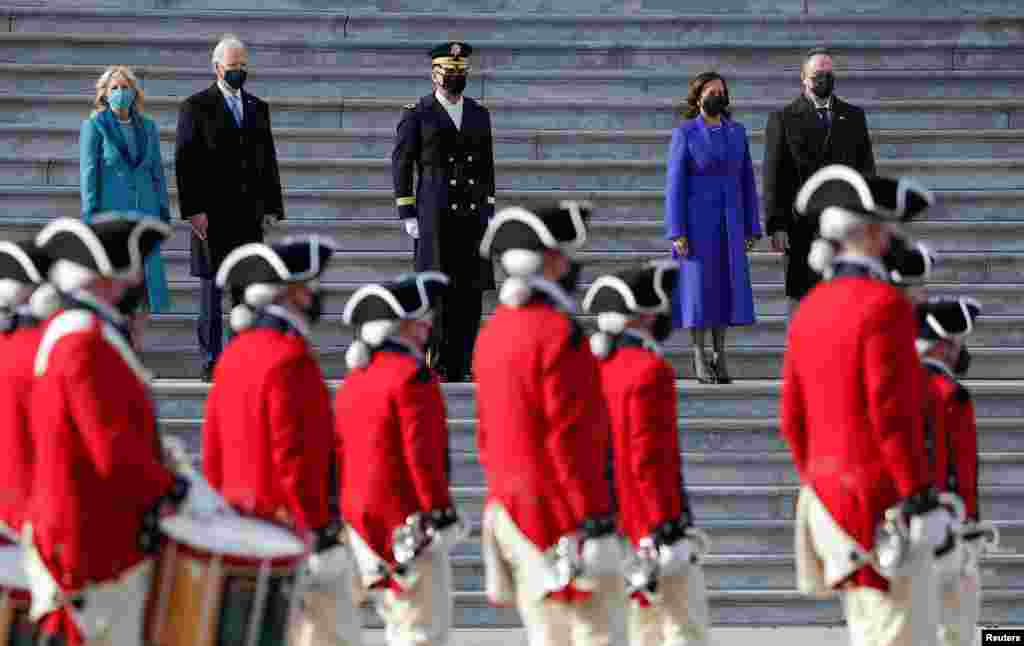 U.S. President Joe Biden, first lady Jill Biden, Vice President Kamala Harris, and her husband Doug Emhoff look on after the inauguration ceremony, in Washington, U.S., January 20, 2021. REUTERS/Tom Brenner