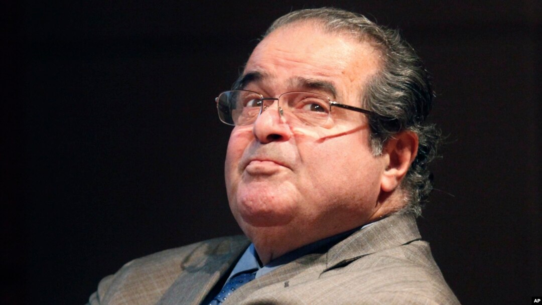 In this Oct. 18, 2011 file photo, U.S. Supreme Court justice Antonin Scalia looks into the balcony before addressing the Chicago-Kent College Law justice in Chicago. 